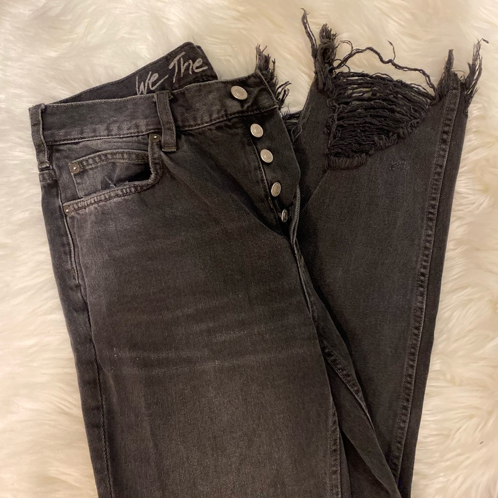 Free people black mom jeans with fringe ankles.